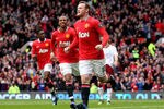 MANCHESTER, ENGLAND - APRIL 15:  Wayne Rooney of Manchester United celebrates scoring the opening goal during the Barclays Premier League match between Manchester United and Aston Villa at Old Trafford on April 15, 2012 in Manchester, England.  (Photo by Alex Livesey/Getty Images)