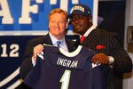 NEW YORK, NY - APRIL 26:  Melvin Ingram of South Carolina holds up a jersey as he stands on stage with NFL Commissioner Roger Goodell after he was selected #18 overall by the San Diego Chargers in the first round of the 2012 NFL Draft at Radio City Music Hall on April 26, 2012 in New York City.  (Photo by Al Bello/Getty Images)
