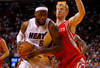 MIAMI, FL - APRIL 22:  LeBron James #6 of the Miami Heat drives on Chase Budinger #10 of the Houston Rockets during a game at American Airlines Arena on April 22, 2012 in Miami, Florida. NOTE TO USER: User expressly acknowledges and agrees that, by downloading and/or using this Photograph, User is consenting to the terms and conditions of the Getty Images License Agreement.  (Photo by Mike Ehrmann/Getty Images)