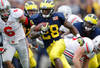 ANN ARBOR, MI - NOVEMBER 26:  Fitzgerald Toussaint #28 of the Michigan Wolverines gets in the open field during a fourth quarter run while playing the Ohio State Buckeyes of the Michigan Wolverines at Michigan Stadium on November 26, 2011 in Ann Arbor, Michigan. (Photo by Gregory Shamus/Getty Images)