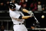 CHICAGO, IL - APRIL 27: Paul Konerko #14 of the Chicago White Sox hits a single in the third inning against the Boston Red Sox on April 27, 2012 at U.S. Cellular Field in Chicago, Illinois.  (Photo by David Banks/Getty Images)
