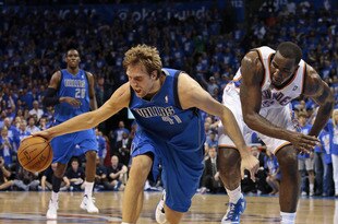 OKLAHOMA CITY, OK - APRIL 28:  Dirk Nowitzki #41 of the Dallas Mavericks recovers a loose ball by Kendrick Perkins #5 of the Oklahoma City Thunder in Game One of the Western Conference Quarterfinals in the 2012 NBA Playoffs on April 28, 2012 at the Chesapeake Energy Arena in Oklahoma City, Oklahoma. Oklahoma City defeated Dallas 99-98. NOTE TO USER: User expressly acknowledges and agrees that, by downloading and or using the photograph, User is consenting to the terms and conditions of the Getty Images License Agreement. (Photo by Brett Deering/Getty Images)