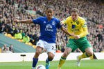 NORWICH, ENGLAND - APRIL 07:  Steven Pienaar of Everton is challenged by Grant Holt of Norwich during the Barclays Premier League match between Norwich City and Everton at Carrow Road on April 7, 2012 in Norwich, England.  (Photo by Mike Hewitt/Getty Images)