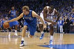 OKLAHOMA CITY, OK - APRIL 28:  Dirk Nowitzki #41 of the Dallas Mavericks recovers a loose ball by Kendrick Perkins #5 of the Oklahoma City Thunder in Game One of the Western Conference Quarterfinals in the 2012 NBA Playoffs on April 28, 2012 at the Chesapeake Energy Arena in Oklahoma City, Oklahoma. Oklahoma City defeated Dallas 99-98. NOTE TO USER: User expressly acknowledges and agrees that, by downloading and or using the photograph, User is consenting to the terms and conditions of the Getty Images License Agreement. (Photo by Brett Deering/Getty Images)