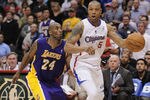 LOS ANGELES, CA - APRIL 04:  Caron Butler #5 of the Los Angeles Clippers keeps his dribble from Kobe Bryant #24 of the Los Angeles Lakers during a 113-108 Laker win at Staples Center on April 4, 2012 in Los Angeles, California.  NOTE TO USER: User expressly acknowledges and agrees that, by downloading and or using this photograph, User is consenting to the terms and conditions of the Getty Images License Agreement.  (Photo by Harry How/Getty Images)