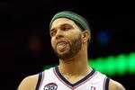 NEWARK, NJ - APRIL 10:  Deron Williams #8 of the New Jersey Nets looks on in the second half against the Philadelphia 76ers at Prudential Center on April 10, 2012 in Newark, New Jersey.  NOTE TO USER: User expressly acknowledges and agrees that, by downloading and or using this photograph, User is consenting to the terms and conditions of the Getty Images License Agreement.  (Photo by Chris Chambers/Getty Images)