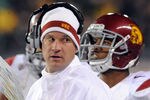 EUGENE, OR - NOVEMBER 19: Head coach Lane Kiffin of the USC Trojans speaks with his team in the first half of the game against the Oregon Ducks at Autzen Stadium on November 19, 2011 in Eugene, Oregon. (Photo by Steve Dykes/Getty Images)
