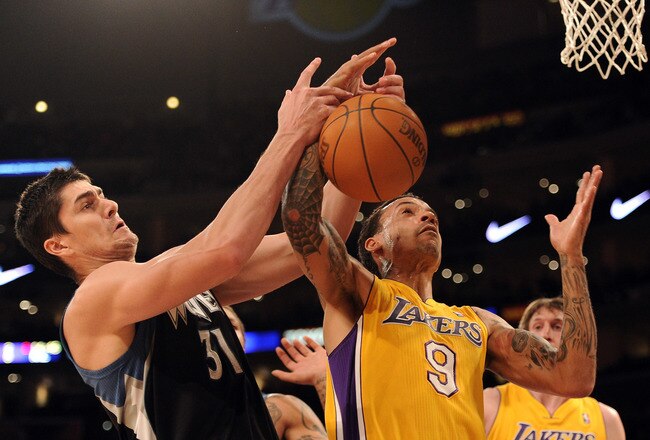 LOS ANGELES, CA - FEBRUARY 29:  Matt Barnes #9 of the Los Angeles Lakers and Darko Milicic #31 of the Minnesota Timberwolves battle for a rebound at Staples Center on February 29, 2012 in Los Angeles, California.  NOTE TO USER: User expressly acknowledges and agrees that, by downloading and or using this photograph, User is consenting to the terms and conditions of the Getty Images License Agreement.  (Photo by Harry How/Getty Images)