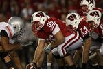 MADISON, WI - OCTOBER 16: Peter Konz #66 of the Wisconsin Badgers prepares to snap the ball to Scott Tolzien #16 against the Ohio State Buckeyes at Camp Randall Stadium on October 16, 2010 in Madison, Wisconsin. Wisconsin defeated Ohio State 31-18. (Photo by Jonathan Daniel/Getty Images)
