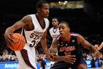 NEW YORK, NY - NOVEMBER 18:  Deville Smith #33 of the Mississippi State Bulldogs drives the ball against Josiah Turner #11 of the Arizona WIldcats during the 2K Sports Classic Benefiting Coaches Vs Cancer at Madison Square Garden on November 18, 2011 in New York City.  (Photo by Patrick McDermott/Getty Images)