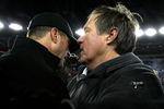 FOXBORO, MA - JANUARY 22:  Head coach Bill Belichick (R) of the New England Patriots talks with head coach John Harbaugh (L) of the Baltimore Ravens after the AFC Championship Game at Gillette Stadium on January 22, 2012 in Foxboro, Massachusetts. The New England Patriots defeated the Baltimore Ravens 20-23.  (Photo by Jim Rogash/Getty Images)