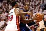 MIAMI, FL - APRIL 28:  Forward Amar'e Stoudemire #1 (R) of the New York Knicks is defended by Forward Udonis Haslem #40 of the Miami Heat in Game One of the Eastern  Conference Quarterfinals in the 2012 NBA Playoffs  on April 28, 2012 at the American Airines Arena in Miami, Florida. NOTE TO USER: User expressly acknowledges and agrees that, by downloading and or using this photograph, User is consenting to the terms and conditions of the Getty Images License Agreement.  (Photo by Marc Serota/Getty Images)