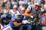 ORCHARD PARK, NY - SEPTEMBER 25: Rob Gronkowski #87 of the New England Patriots runs after a catch as  George Wilson #37 of the Buffalo Bills comes in for the tackle at Ralph Wilson Stadium on September 25, 2011 in Orchard Park, New York.  (Photo by Rick Stewart/Getty Images)