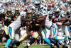 CHARLOTTE, NC - OCTOBER 09:   Jimmy Graham #80 of the New Orleans Saints is tackled by the defense of the Carolina Panthers during their game at Bank of America Stadium on October 9, 2011 in Charlotte, North Carolina.  (Photo by Streeter Lecka/Getty Images)