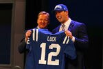 NEW YORK, NY - APRIL 26:  Andrew Luck (R) from Stanford holds up a jersey as he stands on stage with NFL Commissioner Roger Goodell after Luck was selected #1 overall by the Indianapolis Colts in the first round of the 2012 NFL Draft at Radio City Music Hall on April 26, 2012 in New York City.  (Photo by Al Bello/Getty Images)
