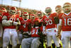 NEW BRUNSWICK, NJ - NOVEMBER 19:  Eric LeGrand #52 of the Rutgers Scarlet Knights posses for a photo with teammates on Senior's Day at center field before a game against Cincinnati Bearcats at Rutgers Stadium on November 19, 2011 in New Brunswick, New Jersey. LeGrand was paralyzed during a kickoff return in October 2010.  (Photo by Patrick McDermott/Getty Images)
