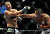 LAS VEGAS - JULY 11:  (R-L) Dan Henderson connects with a right to Mike Bisping during their middleweight bout during UFC 100 on July 11, 2009 in Las Vegas, Nevada.  (Photo by Jon Kopaloff/Getty Images)