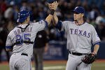 TORONTO, CANADA - APRIL 30: Mike Napoli #25 and Joe Nathan #36 of the Texas Rangers celebrate the win against the Texas Rangers during MLB action at the Rogers Centre April 30, 2012 in Toronto, Ontario, Canada.  (Photo by Abelimages/Getty Images)
