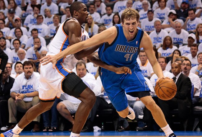 OKLAHOMA CITY, OK - APRIL 30:  Dirk Nowitzki #41 of the Dallas Mavericks drives on Serge Ibaka #9 of the Oklahoma City Thunder in Game Two of the Western Conference Quarterfinals in the 2012 NBA Playoffs on April 30, 2012 at the Chesapeake Energy Arena in Oklahoma City, Oklahoma. Oklahoma City defeated Dallas 102-99. NOTE TO USER: User expressly acknowledges and agrees that, by downloading and or using the photograph, User is consenting to the terms and conditions of the Getty Images License Agreement. (Photo by Brett Deering/Getty Images)