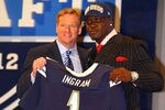 NEW YORK, NY - APRIL 26:  Melvin Ingram of South Carolina holds up a jersey as he stands on stage with NFL Commissioner Roger Goodell after he was selected #18 overall by the San Diego Chargers in the first round of the 2012 NFL Draft at Radio City Music Hall on April 26, 2012 in New York City.  (Photo by Al Bello/Getty Images)