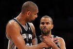 LOS ANGELES, CA - APRIL 17:  Tim Duncan #21 and Tony Parker #9 of the San Antonio Spurs talk during a break in the game against the Los Angeles Lakers at Staples Center on April 17, 2012 in Los Angeles, California.  NOTE TO USER: User expressly acknowledges and agrees that, by downloading and or using this photograph, User is consenting to the terms and conditions of the Getty Images License Agreement.  (Photo by Harry How/Getty Images)