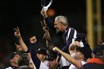 DETROIT - OCTOBER 07:  Manager Jim Leyland #10 of the Detroit Tigers is carried off the field by his player as they celebrate after the Tigers recorded the last out to beat the New York Yankees 8-3 in Game Four of the 2006 American League Division Series on October 7, 2006 at Comerica Park in Detroit, Michigan. With the win the Tigers won the series 3-1 to advance to the ALCS  (Photo by Elsa/Getty Images)