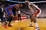 MIAMI, FL - APRIL 30:  Carmelo Anthony #7 of the New York Knicks drives on LeBron James #6 of the Miami Heat during Game Two of the Eastern Conference Quarterfinals in the 2012 NBA Playoffs  at American Airlines Arena on April 30, 2012 in Miami, Florida. NOTE TO USER: User expressly acknowledges and agrees that, by downloading and/or using this Photograph, User is consenting to the terms and conditions of the Getty Images License Agreement.  (Photo by Mike Ehrmann/Getty Images)
