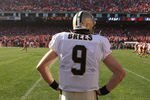 SAN FRANCISCO, CA - JANUARY 14:  Quarterback Drew Brees #9 of the New Orleans Saints watch from the sidelines during the second quarter of the NFC Divisional playoff game against the San Francisco 49ers at Candlestick Park on January 14, 2012 in San Francisco, California.  (Photo by Ezra Shaw/Getty Images)
