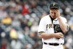 PITTSBURGH, PA - APRIL 22:  Erik Bedard #45 of the Pittsburgh Pirates wipes the sweat off of his face in between pitches against the St Louis Cardinals during the game on April 22, 2012 at PNC Park in Pittsburgh, Pennsylvania.  (Photo by Jared Wickerham/Getty Images)