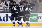 LOS ANGELES, CA - MAY 03:  (R-L) Justin Williams #14 of the Los Angeles Kings celebrates with teammates Anze Kopitar #11 and Dustin Brown #23 after Williams scores a first period goal against the St. Louis Blues in Game Three of the Western Conference Semifinals during the 2012 NHL Stanley Cup Playoffs at Staples Center on May 3, 2012 in Los Angeles, California.  (Photo by Harry How/Getty Images)