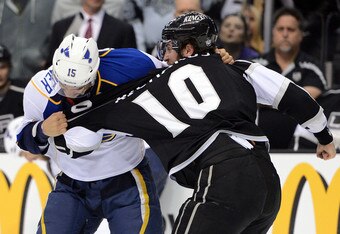 LOS ANGELES, CA - MAY 03:  Jamie Langenbrunner #15 of the St. Louis Blues and Mike Richards #10 of the Los Angeles Kings exchange punches in the first period in Game Three of the Western Conference Semifinals during the 2012 NHL Stanley Cup Playoffs at Staples Center on May 3, 2012 in Los Angeles, California. Langenbrunner and Richards both were given penalties for fighting and Richards was awarded an additional penalty for slashing. (Photo by Harry How/Getty Images)