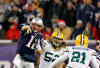 FOXBORO, MA - DECEMBER 19:  Quarterback Tom Brady #12 of the New England Patriots throws a pass against the Green Bay Packers in the first quarter of the game at Gillette Stadium on December 19, 2010 in Foxboro, Massachusetts.  (Photo by Jim Rogash/Getty Images)