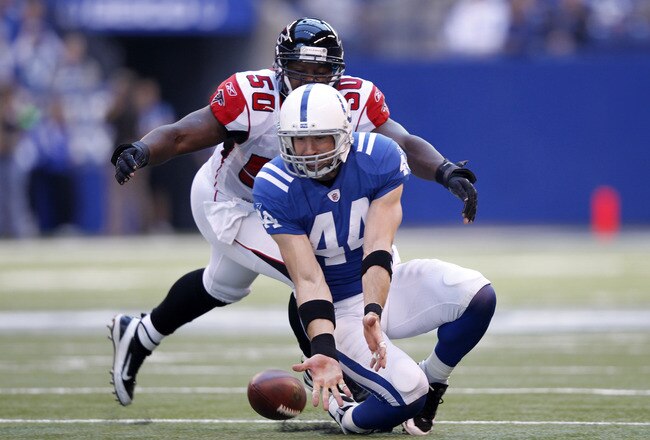 INDIANAPOLIS, IN - NOVEMBER 6: Dallas Clark #44 of the Indianapolis Colts tries to make a reception in front of Curtis Lofton #50 of the Atlanta Falcons at Lucas Oil Stadium on November 6, 2011 in Indianapolis, Indiana. The Falcons defeated the Colts 31-7. (Photo by Joe Robbins/Getty Images)