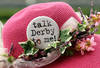 LOUISVILLE, KY - MAY 07:  A detail of a hat with a pin on it which reads 'Talk derby to me!' during the 137th Kentucky Derby at Churchill Downs on May 7, 2011 in Louisville, Kentucky.  (Photo by Al Bello/Getty Images)