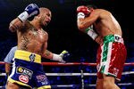 NEW YORK, NY - DECEMBER 03:  Miguel Cotto of Puerto Rico throws a left handed punch against Antonio Margarito of Mexico during the WBA World Junior Middleweight Title fight at Madison Square Garden on December 3, 2011 in New York City.  (Photo by Al Bello/Getty Images)