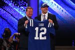 NEW YORK, NY - APRIL 26:  Andrew Luck (R) from Stanford holds up a jersey as he stands on stage with NFL Commissioner Roger Goodell after Luck was selected #1 overall by the Indianapolis Colts in the first round of the 2012 NFL Draft at Radio City Music Hall on April 26, 2012 in New York City.  (Photo by Chris Chambers/Getty Images)