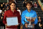 PARIS, FRANCE - JUNE 05:  (L to R) Runner up Roger Federer of Switzerland and Champion Rafael Nadal of Spain pose following the men's singles final match between Rafael Nadal of Spain and Roger Federer of Switzerland on day fifteen of the French Open at Roland Garros on June 5, 2011 in Paris, France.  (Photo by Matthew Stockman/Getty Images)