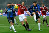MILAN, ITALY - JANUARY 15:  Zlatan Ibrahimovic of AC Milan (centre L) and Lucio of FC Internazionale Milano compete for the ball during the Serie A match between AC Milan and FC Internazionale Milano at Stadio Giuseppe Meazza on January 15, 2012 in Milan, Italy.  (Photo by Claudio Villa/Getty Images)