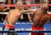 LAS VEGAS, NV - MAY 05:  (L-R) Miguel Cotto connects with a right to the face of Floyd Mayweather Jr. fight during their WBA super welterweight title fight at the MGM Grand Garden Arena on May 5, 2012 in Las Vegas, Nevada.  (Photo by Ethan Miller/Getty Images)