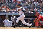 NEW YORK, NY - APRIL 14:  Derek Jeter #2 of the New York Yankees hits a single against the Los Angeles Angels of Anaheim at Yankee Stadium on April 14, 2012 in the Bronx borough of New York City.  (Photo by Nick Laham/Getty Images)