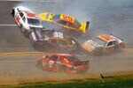 TALLADEGA, AL - APRIL 26:  Scott Riggs, driver of the #36 Tommy Baldwin Racing Toyota, Kevin Harvick, driver of the #29 Shell/Pennzoil Chevrolet, Jamie McMurray, driver of the #26 Crown Royal Ford, Jeff Gordon, driver of the #24 Dupont/Pepsi Chevrolet, and Kasey Kahne, driver of the #9 Budweiser Dodge, crash in turn four during the NASCAR Sprint Cup Series Aaron's 499 at Talladega Superspeedway on April 26, 2009 in Talladega, Alabama.  (Photo by John Harrelson/Getty Images)