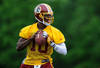 ASHBURN, VA - MAY 06: Robert Griffin III #10 of the Washington Redskins drops back during the Washington Redskins rookie minicamp on May 6, 2012 in Ashburn, Virginia. (Photo by Patrick McDermott/Getty Images)