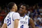 NEW ORLEANS, LA - APRIL 02:  Anthony Davis #23 and Michael Kidd-Gilchrist #14 of the Kentucky Wildcats react late in the second half while taking on the Kansas Jayhawks in the National Championship Game of the 2012 NCAA Division I Men's Basketball Tournament at the Mercedes-Benz Superdome on April 2, 2012 in New Orleans, Louisiana.  (Photo by Jeff Gross/Getty Images)