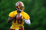 ASHBURN, VA - MAY 06: Robert Griffin III #10 of the Washington Redskins drops back during the Washington Redskins rookie minicamp on May 6, 2012 in Ashburn, Virginia. (Photo by Patrick McDermott/Getty Images)