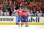 WASHINGTON, DC - MAY 05: Mike Green #52 of the Washington Capitals celebrates with Alex Ovechkin #8 and Dennis Wideman #6 after scoring the game winning goal in the third period against the New York Rangers in Game Four of the Eastern Conference Semifinals during the 2012 NHL Stanley Cup Playoffs at the Verizon Center on May 5, 2012 in Washington, DC. Washington won the game 3-2. (Photo by Greg Fiume/Getty Images)