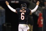 CHICAGO, IL - NOVEMBER 20:  Jay Cutler #6 of the Chicago Bears tries to quiet down the crowd against the San Diego Chargers at Soldier Field on November 20, 2011 in Chicago, Illinois. The Bears defeated the Chargers 31-20.  (Photo by Jonathan Daniel/Getty Images)