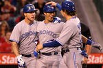 ANAHEIM, CA - MAY 03:  J.P. Arencibia #9 (C) of the Toronto Blue Jays is greeted by Colby Rasmus #28 (R) and Brett Lawrie #13 as they all score on Arencibia's three run home run in the third inning against the Los Angeles Angels of Anaheim at Angel Stadium of Anaheim on May 3, 2012 in Anaheim, California.  (Photo by Stephen Dunn/Getty Images)