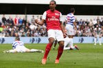 LONDON, ENGLAND - MARCH 31:  Theo Walcott of Arsenal celebrates scoring his side's equalising goal during the Barclays Premier League match between Queens Park Rangers and Arsenal at Loftus Road on March 31, 2012 in London, England.  (Photo by Ian Walton/Getty Images)