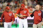 WASHINGTON, DC - MAY 06:  Jayson Werth #28 of the Washington Nationals is helped off the field by manager Davey Johnson and assistant athletic trainer Mike McGowan after injuring his wrist in the sixth inning against the Philadelphia Phillies at Nationals Park on May 6, 2012 in Washington, DC.  (Photo by Greg Fiume/Getty Images)