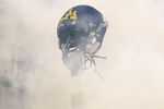 MORGANTOWN, WV - NOVEMBER 25: A member of the West Virginia Mountaineers holds up his helmet before the take the field against the University of Pittsburgh Panthers during the 2011 Backyard Brawl on November 25, 2011 at Mountaineer Field in Morgantown, West Virginia.  (Photo by Jared Wickerham/Getty Images)